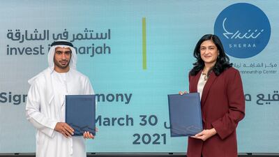 A new partnership between Sharjah Entrepreneurship Center (Sheraa) and Sharjah FDI Office (Invest in Sharjah) will help accelerate the growth of the emirate's start-up community. The agreement was signed by Najla Al Midfa, CEO of Sheraa, and Mohamed Juma Al Musharrkh, CEO of Invest in Sharjah. Courtesy Shurooq-Sharjah