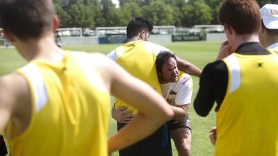 Retired New Zealand rugby star Josh Kronfeld held a series of drills on Friday for the youngsters that are part of the Dubai Rugby Academy. Here, Kronfeld goes over a tackling drill. Lee Hoagland/The National