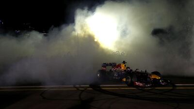 Daniel Ricciardo and Sebastian Vettel drive during an Infiniti Red Bull Racing show run in Dubai.