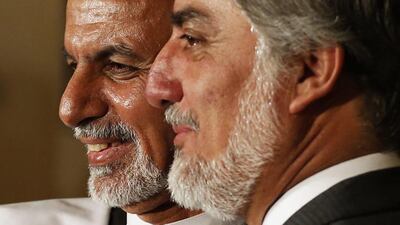 Ashraf Ghani, left, and Abdullah Abdullah address a news conference in Kabul on July 12, 2014. Mohammad Ismail / Reuters