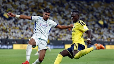 Al Nassr's Sadio Mane battles with Al Fateh's Saeed Baattia. Reuters