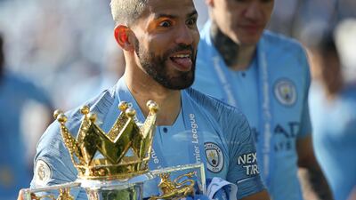 (FILE) - Manchester City's Sergio Aguero celebrates with the Premier League trophy after the English Premier League soccer match between Brighton and Hove Albion and Manchester City in Brighton, Britain, 12 May 2019 (re-issued on 15 December 2021). Argentinian striker Sergio 'Kun' Aguero announced his retirement during a press conference in Barcelona, Spain, on 15 December 2021. EPA/JAMES BOARDMAN EDITORIAL USE ONLY. No use with unauthorized audio, video, data, fixture lists, club/league logos or 'live' services. Online in-match use limited to 120 images, no video emulation. No use in betting, games or single club/league/player publications. *** Local Caption *** 55203430