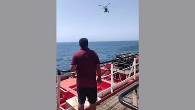 A helicopter arrives to rescue crew onboard the MT Marivex after it was hit by US missiles off Oman. All photos: All India Seafarers and General Workers Union