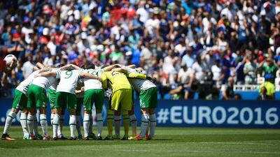 Ireland players take part in a huffle ahead of kick-off. Martin Bureau / AFP