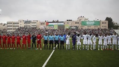 The Saudi and Palestinian national football teams listen to their national anthems during a World Cup 2022 Asian qualifying match between Palestine and Saudi Arabia in the town of al-Ram in the Israeli occupied West Bank. The game would mark a change in policy for Saudi Arabia, which has previously played matches against Palestine in third countries. Arab clubs and national teams have historically refused to play in the West Bank, where the Palestinian national team plays, as it required them to apply for Israeli entry permits. AFP