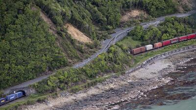 A freight train is seen trapped by landslides in the area north of Kaikoura. Mark Mitchell / New Zealand Herald Pool Photo via AP