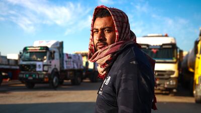 Aid lorry drivers wait near the Rafah crossing between Egypt and Gaza, February 2024. Victor Besa / The National