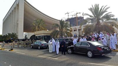 Kuwaiti opposition MPs gather outside the parliament building in Kuwait City. AFP