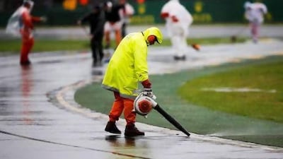 Despite the marshals' best efforts to clear water from the track Saturday's qualifying session for the Australian Grand Prix was pushed back to Sunday.