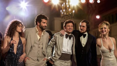 From left, Amy Adams, Bradley Cooper, Jeremy Renner, Christian Bale and Jennifer Lawrence in a scene from “American Hustle.” Francois Duhamel / AP photos / Sony