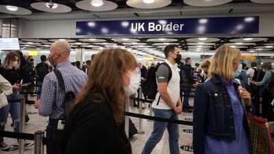 Arriving passengers queue at UK Border Control at Terminal 5 at Heathrow Airport in London. Reuters.