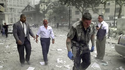 Debris covers streets including Park Row, which is nearly half a kilometre away from Ground Zero, after the towers collapsed. AFP