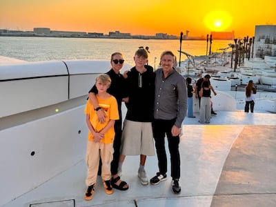 From left to right: Monty, 12, Jaime, Gibson, 14, and Justin Cooke, who moved to Abu Dhabi last year. Photo: Justin Cooke