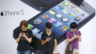 Even top-of-the-range Apple products such as the iPhone 5 were being heavily discounted by electronics retailers as Asian manufacturers undercut western IT companies. Akio Kon / Bloomberg