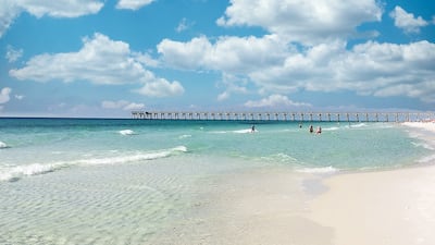 5. View of Pensacola Beach with the fishing pier in the far distance in Florida, US.