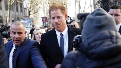 Prince Harry arrives at a court in London on Monday as the lawyer for a group of British tabloids prepared to ask a judge to toss out lawsuits by the prince and several other celebrities who allege phone tapping and other invasions of privacy. AP