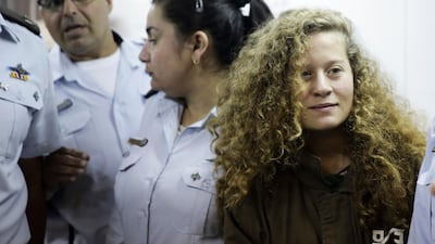 An Israeli minister has said the Ahed Al Tamimi's parents are guilty of "child abuse' in a heated exchange on British radio (AP Photo/Mahmoud Illean, File)
