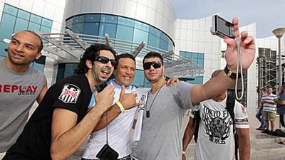 UFC fighter Renzo Gracie, centre, poses with fans outside Marina Mall yesterday.