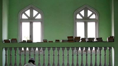 A Nepalese Muslim man reads the Quran during the Muslim holy month of Ramadan at a mosque in Kathmandu, Nepal. Navesh Chitrakar / Reuters