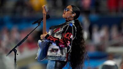 HER proved her rock star status with a guitar and leather jacket. AP