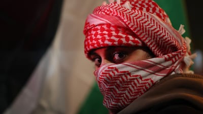 Protesters outside the stadium before the match. Reuters