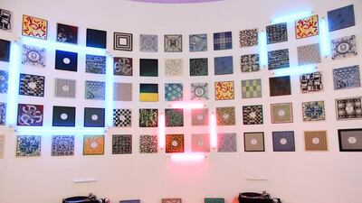 A room lined in record covers, made from Hermès scarves. Each one contained a record that could be listened to on a turntable via headphones. Courtesy Hermès