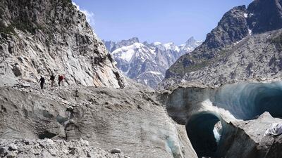 People walk on the Mer de Glace (Sea of Ice), in Chamonix-Mont-Blanc, in the French Alps. AFP