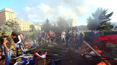 Lebanese security forces intervene between clashing demonstrators and counter-protesters in the centre of the capital Beirut during the 13th day of anti-government protests. AFP