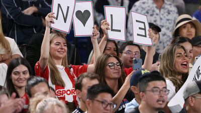 Novak Djokovic fans hold up a sign in support during his match against Adrian Mannarino. AFP