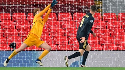 Liverpool goalkeeper Caoimhin Kelleher makes a save against Ajax. EPA