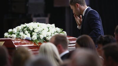 Australia cricket captain Michael Clarke pays his respect to Phillip Hughes during Hughes' funeral on Wednesday in Macksville, Australia. Cameron Spencer / EPA