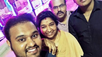 Akash Vasu, left, says his father, Vasu Ponnuchami, second right, will be cremated on June 1, nearly three weeks after he died of a heart attack in Sharjah. Ponnuchami family