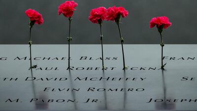 Flowers are left on the National 9/11 Memorial to mark the anniversary of the 2001 attacks. Reuters