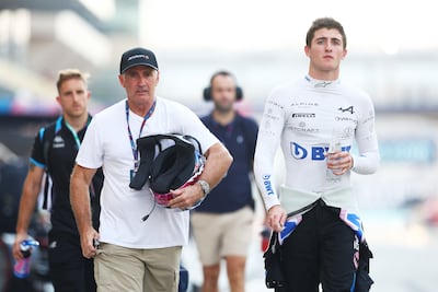 Alpine F1 reserve driver Jack Doohan walks the pit lane of the Yas Marina Circuit. Getty Images