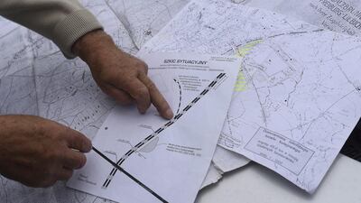 Tadeusz Slowikowski, a local explorer, points on map of the area where a Nazi train is believed to be at. Kornelia Glowacka-Wolf, Agencja Gazet/Reuters