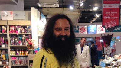 Indian spiritual guru Gurmeet Ram Rahim poses for a photograph after he was spotted shopping in New Delhi on January 5, 2015. Indian police said they are investigating a popular self-styled godman for allegedly encouraging 400 followers to undergo castrations at his ashram so they could get closer to god. Chandan Khanna / AFP Photo