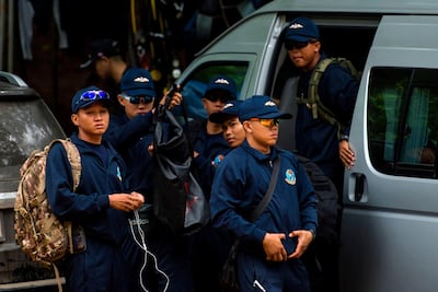 Thai Navy personnel arrive as rescue operations continue for 12 boys and their coach trapped in a flooded cave in Chiang Rai province on July 6, 2018. Ye Aung Thu / AFP