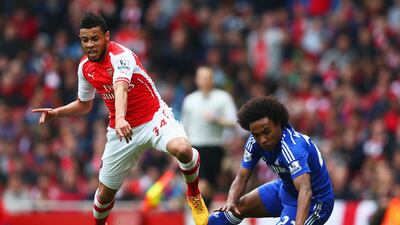 Arsenal's Francis Coquelin challenges Chelsea's Willian on Sunday during their scoreless draw in the Premier League. Paul Gilham / Getty Images