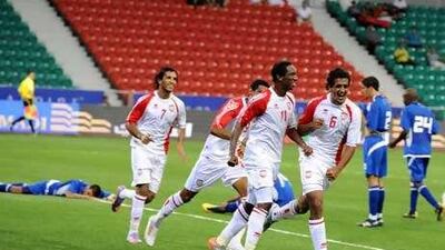 Faisal Khalil, No 11, celebrates with his teammates after scoring the UAE's goal against Kuwait yesterday.