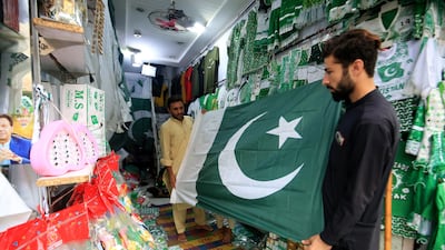 National flags and decorations for sale ahead of Pakistan's Independence Day in Peshawar on Tuesday. EPA