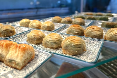 Trays of baklava, including rolled, syrup-soaked pastries filled with nuts from Turkish House. Victor Besa / The National