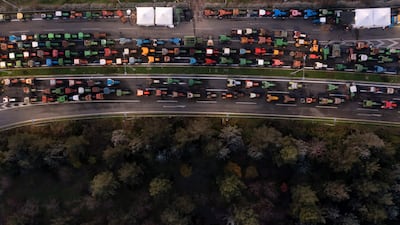 Tractors blockade a motorway outside the Greek city of Larissa, during a farmers' protest to demand swifter access to EU subsidies delayed by a continuing investigation into multi-million fraud. AFP