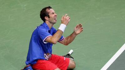 Radek Stepanek collapses with emotion after winning the Davis Cup for the Czech Republic