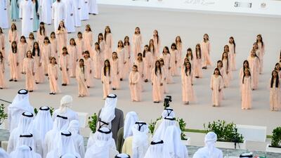 Sheikh Mohamed stands for the national anthem during the Union Parade at the Sheikh Zayed Heritage Festival. Eissa Al Hammadi for the Presidential Court