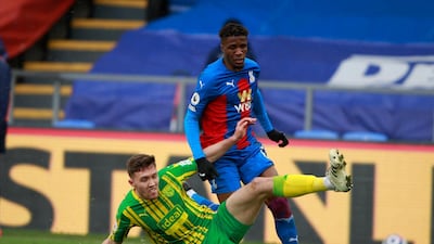 Crystal Palace's Wilfried Zaha, right, and West Bromwich Albion's Dara O'Shea challenge for the ball at Selhurst Park. AP