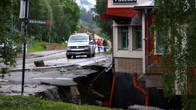 A section of road was swept away after the Susa river overflowed in Are, northern Sweden. Reuters