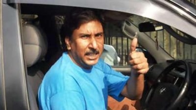 The Pakistani former Test cricketer Salim Malik gestures as he leaves the session court in Lahore.