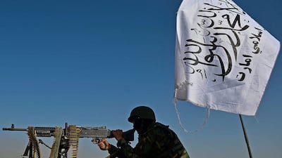 A Taliban fighter mans a machine gun mounted on a vehicle near the venue of an open-air pro-Taliban rally on the outskirts of Kabul. AFP