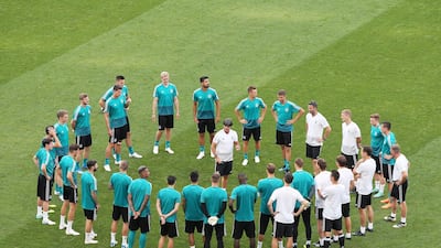 Germany manager Joachim Low is surrounded by his squad during a training session ahead of the World Cup Group F match against Sweden. Mohamed Messara / EPA