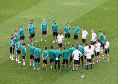 Germany manager Joachim Low is surrounded by his squad during a training session ahead of the World Cup Group F match against Sweden. Mohamed Messara / EPA
